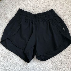 black lululemon 4” tracker shorts